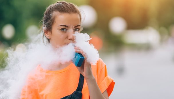 Pretty,Young,Hipster,Woman,Vape,Ecig,,Vaping,Device,At,The
